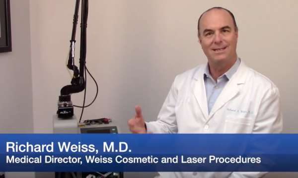 Dr Weiss explaining how a skin rejuvenation laser works